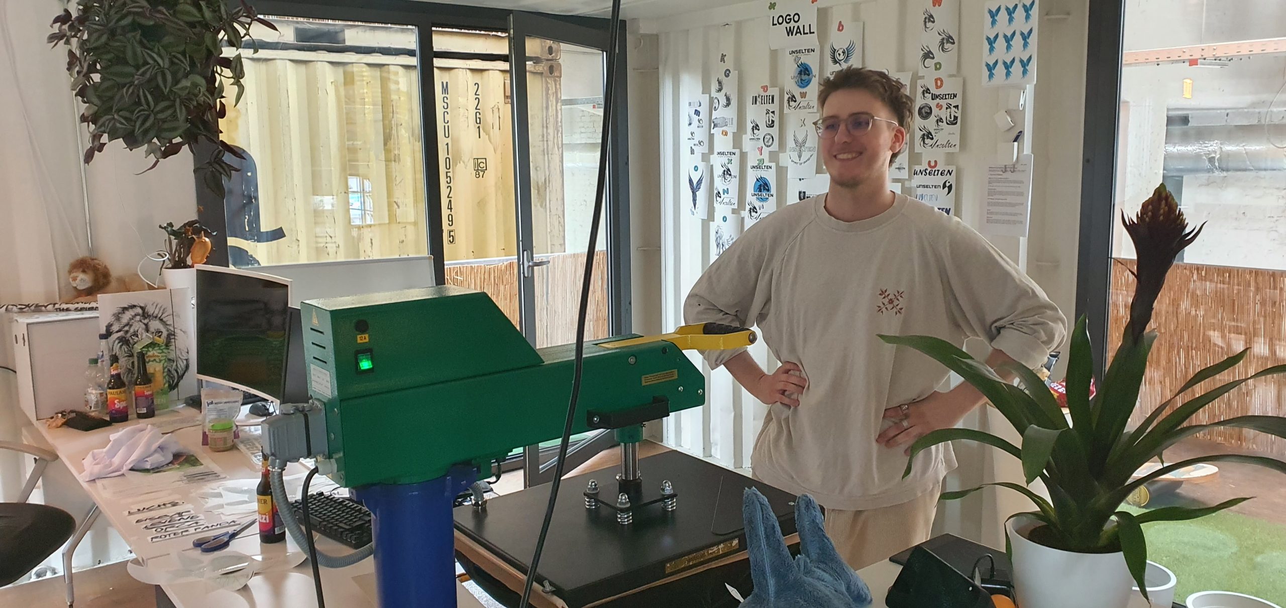 a man standing in front of a machine