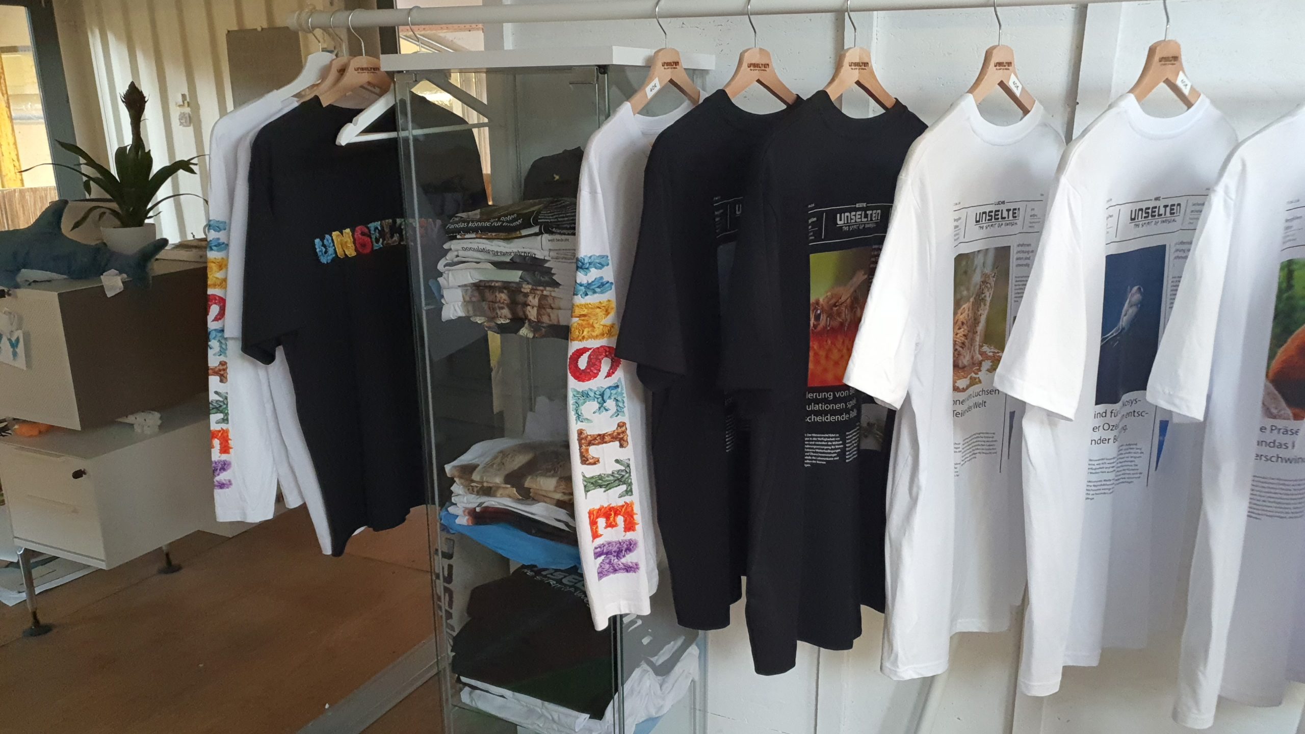 a group of t-shirts on swingers